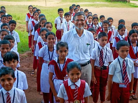 Pakruddin BK, with the students at   Darul Islam Aided Higher Primary School (photo courtesy : Milaap)