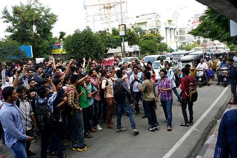 Angered by the death of their classmate, around 30 students travelling in the same bus got down from the vehicle and went on a rampage on the road