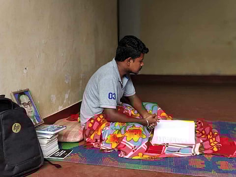 Mahesh Sosle, at the college hostel corridor after being evicted by the authorities