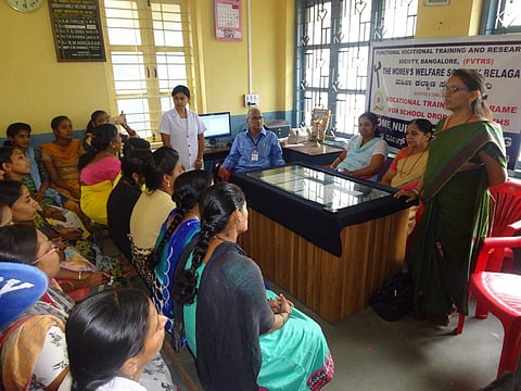 Nagaratna Sunil Ramagouda talking to the factory employees to create awareness about HIV