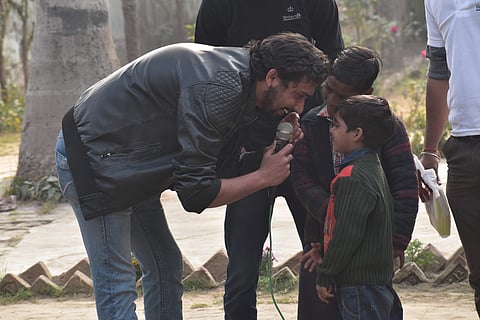 Khan interacting with children during one of his many sessions