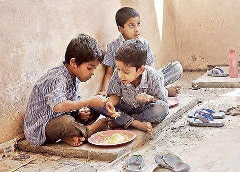There are around 80 plates for  over 500 students, pushing them to share the limited meal during lunch | Vinay Madapu/ Express News Service