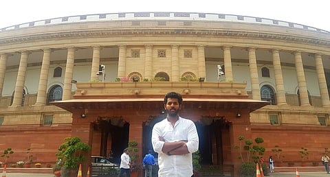 Kilaru posing in front of the Parliament during his 100th visit to it