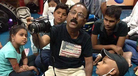 Rajen holds free photography classes to children with disability and autism, in a hope to make them independent