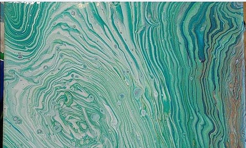 Acrylic pours often look like the marble patterns one can commonly find in nail art