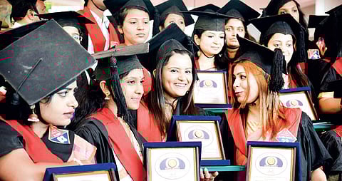 Students with their certificates at the 20th convocation of RGUHS held in Bengaluru on Thursday | Pushkar V