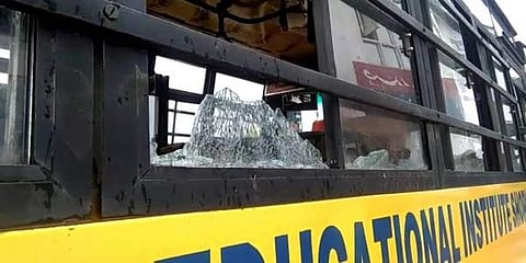 A damaged school bus which was attacked by stone-pelters at Zavoora area in Shopian