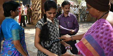 NEET aspirant being checked before entering into the examination centre at Siddhartha public school in Vijayawada last year | P Ravindra Babu