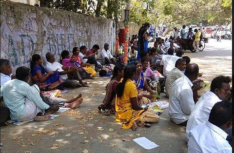 Various centres in Chennai had crowds of parents outside the gates all seated on the pavements in the blistering heat