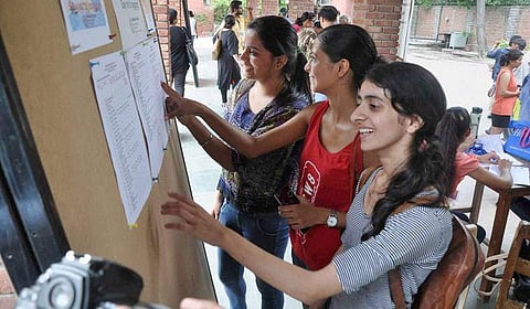 Students checking for their names in the first cut-off list | PTI