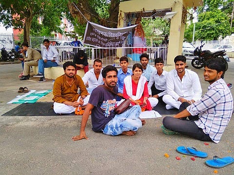 Pooja Shukla aong with the other protestors on campus