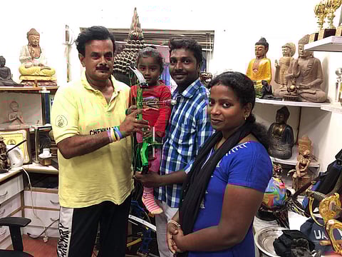 The young prodigy with her coach and her parents