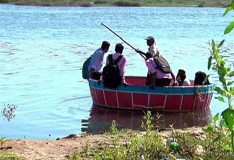 UK Mallanna help school and college student cross Tungabhadra river in Shimoga city (Pic: Shimoga Nandan)