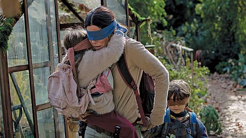 Birdbox stars Sandra Bullock and Trevante Rhodes (pic:Netflix)