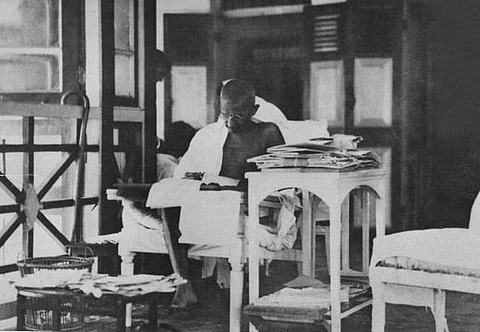 Gandhi writing letters