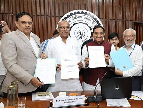 Dr TG Sitharam, Director, IIT Guwahati, Dr Anil D Sahasrabudhe, Chairman, AICTE and MHRD Minister Ramesh Pokhriyal with the MoU (Pic: IIT)