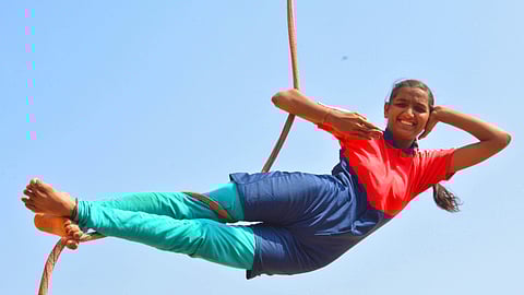 A student at  B D Tatti Residential School performs hanging Mallakhamb (Pic: Hemanth D)