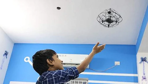 A child playing with drones at an SP Robotics Maker Lab