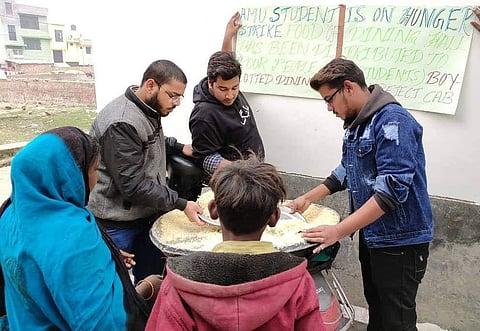 Students distributing the food to those in need
