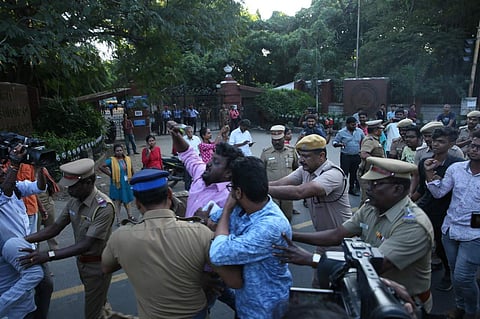 Police dragging away a protester