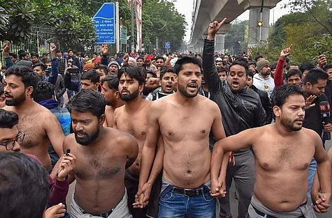Students protest shirtless at the campus of Jamia Millia Islamia following the clashes that emerged between the students and Delhi Police | (Pic: PTI)