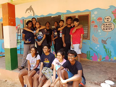 Students after painting a wall | (Pic: Ankith Ratakonda)