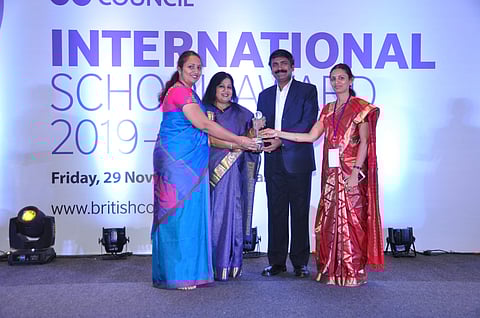 Janaka Pushpanathan (middle) with one of the winners  of the ISA recognition (Pic: British Council)