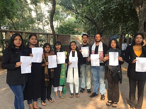 The students hold their resignation letters