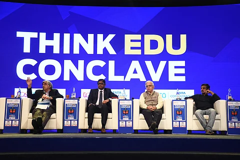 The panelists discussing how best to invest in our education