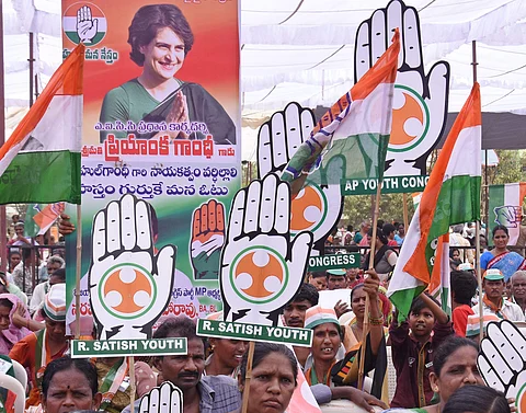 Supporters greet Congress President Rahul Gandhi during his election campaign in Vijaywada  (Pic: Express)