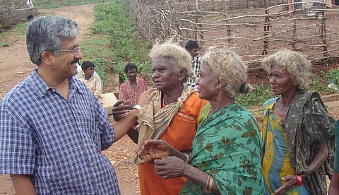 Dr Balasubramaniam with tribal women | (Pic: SVYM)