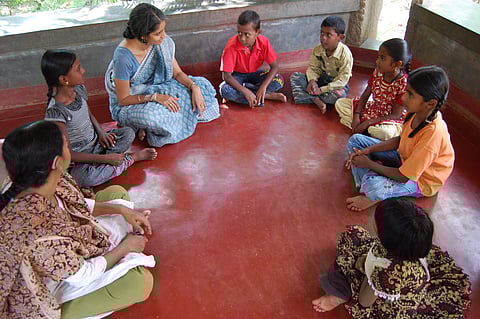 Kamala Mukunda interacting with the children