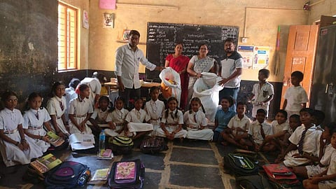 Basavaraj along with his team and school teachers collecting bottles from children