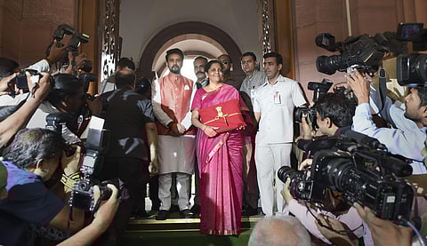 Finance Minister Nirmala Sitharaman and MoS Anurag Thakur arrive at Parliament to present the Union Budget 2019-20 in New Delhi (Pic: PTI)