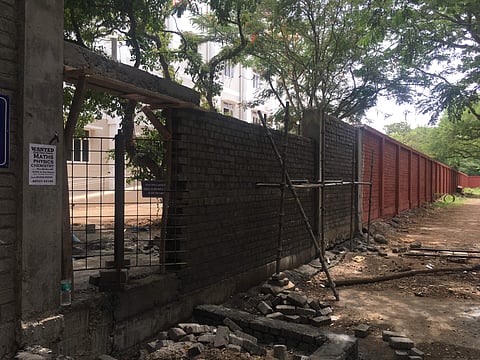 The students had been against the construction of a wall because Madras University students would not have access to the canteen, the library, the ATM