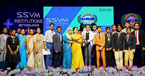 Directors of SSVM Institutions Srisha Nitin and Nitin Jey handing over the best delegation trophy to the SSVM students during the valediction of IIMUN Conference in Coimbatore on Sunday (Pic: Express)