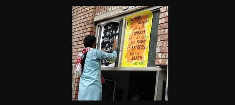 N Sai Balaji sticking posters