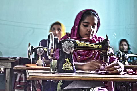 Women weaving muslin