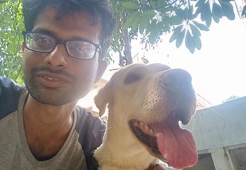 Pradeep with a furry friend | (Pic: Pradeep Yarra)