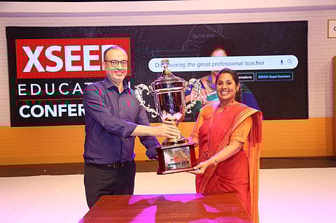 Cassandra receiving the award from Ashish Rajpal, Founder, XSEED Education