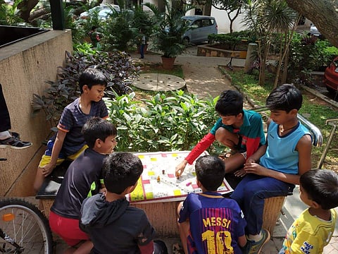 Children playing traditional board games