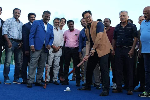 File Photo: Kiren Rijiju tries his hand at hockey at the new Astro Turf at the CSS (Pic: Rakesh Kumar/EDEX)