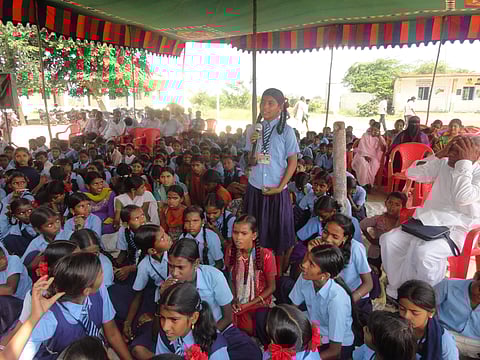 A school girl expressing the issues they face during one of the Grama Sabhas