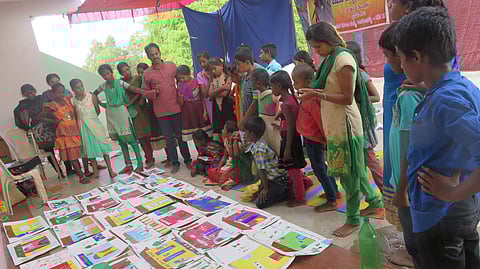 Anantha during painting activity with kids at Ashram school