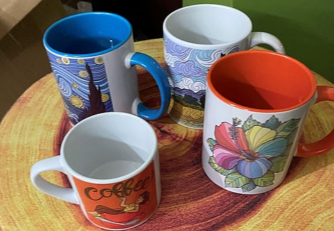 Mugs that have designs made by Preksha