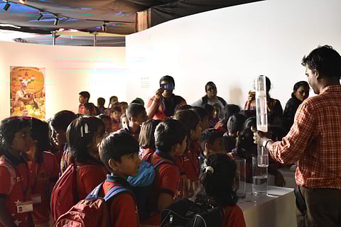 A water experiment being demonstrated for students present at the exhibition (Pic: Care Earth Trust))
