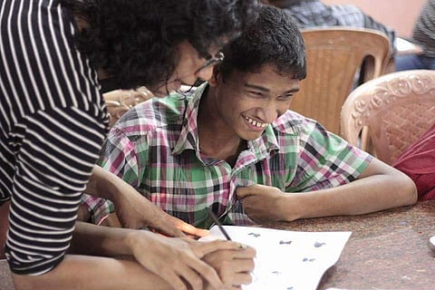 One of the volunteers helping a student (Pic: Ananthu)