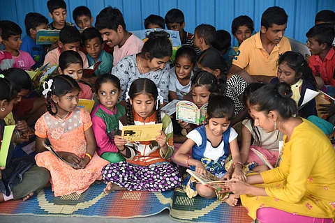 Shalini and Karthik engage children in reading books (Pics: Nagaraja Gadekal)