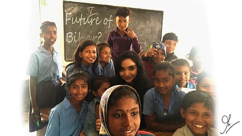Pushpam Priya with school kids from Bihar. Will she be the future of the state? (Pic: Twitter/Edex)