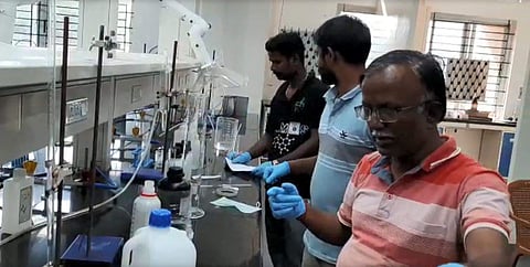 Dr T Mohan Das preparing the sanitiser (Pic: CUTN)